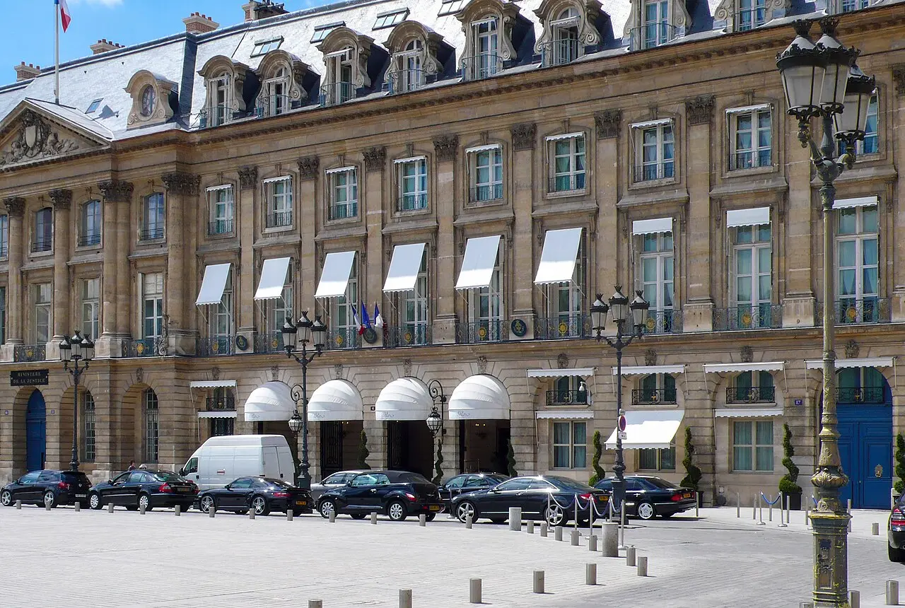 Façade of the Hôtel Ritz on the Place Vendôme, Paris, with white awnings